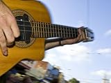 Musician's Fingers Strum the Cords of a Guitar During a Public Show Photographic Poster Print by Jason Edwards, 18x24