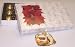 Scott's Cakes 1 Pound White Chocolate Covered Caramels in a Poinsettia Box