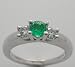 Platinum Classic Three Stone Ring Centering One Emerald 0.28 Ct And Accented With 2 Side Diamonds