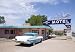 A Classic Car at the Blue Swallow on Route 66, Tucumcari, New Mexico - Iconic 16"x20" Photographic Print by Carol M. Highsmith