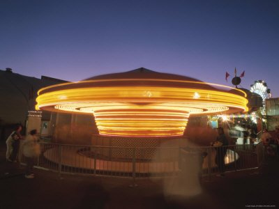 Fun on a Spinning Carousel at Night Photographic Poster Print, 18x24