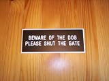 Black Engraved Sign - Beware of the Dog with Shut Gate