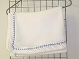 Bk673, Knitted on Hand Knitting Machine Bleached White Blanket Trimmed By Hand Crochet with Two Tone Denim and White Chenille. Bk673, Knitted on Hand Knitting Machine Bleached White Blanket Trimmed By Hand Crochet with Two Tone Denim and White Chenille.