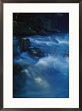 Blue pastel water breaks over rocks at Bittangabee Bay Subject Framed Art Poster Print by Jason Edwards, 21x29