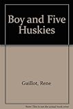 A boy and five huskies