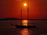 Silhouetted Sailboat, Rockport, Maine Photographic Poster Print by Russell Burden, 24x18