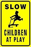 SLOW CHILDREN AT PLAY warn street park sign