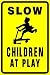 SLOW CHILDREN AT PLAY warn street park sign