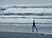 A Person Jogs Along the Beach Premium Photographic Poster Print