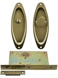 Privacy Pocket Door Mortise Lock Set With Oval Pulls in Antique Brass.
