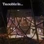 As Trouble Does
