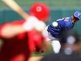 Los Angeles Angels of Anaheim v Texas Rangers, SURPRISE, AZ - MARCH 02: Alexi Ogando and Mike Trout Photographic Poster Print by Christian Petersen, 12x16