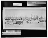 Burkburnett, Texas, the world's wonder oil pool, showing 8 months phenomenal development, viewed from the northwest side, opposite Fowler farm, original discovery well and swinging towards the northwest (Historic Panoramic Photograph: 36