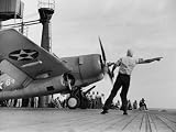 Close Up of Fighter Plane Before Takeoff from Flight Deck of Aircraft Carrier 