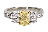 Platinum and 18k Yellow Gold Fancy Intense Yellow Oval Cut Diamond Ring (GIA Certified 1.31 ct center, 2.67 cttw), Size 6
