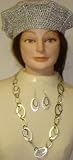 Hand Crocheted Metallic Silver Gimp Beret Offered in Combination with Sterling Silver Plated Large Oval Rings Long Chain Necklace and Earrings