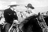 Wild West Feuds Erupt in Marked for Murder DVD (1948). Starring Tex Ritter, Charles King, Henry Hall, Marilyn McConnell, Wen Wrights, and Dave 