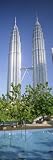Malaysia, Kuala Lumpur, View of Petronas Twin Towers Places Photographic Poster Print by Panoramic Images, 40x120