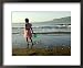 A Girl Walks on the Beach in Jacmel, Haiti, in This February 5, 2001 Framed Art Poster Print by Lynne Sladky, 22x18