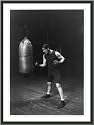 Historic Print (L): Corbett punching the bag to get in condition to handle Jeffries for the championship fig