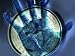 Abstract View of a Blue Hand over a Stop Watch Photographic Poster Print