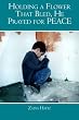 Holding a Flower That Bled, He Prayed for PEACE