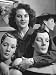 Close Up of Saleswoman at Neiman Marcus Hugging Mannequin Heads at Department Store P...