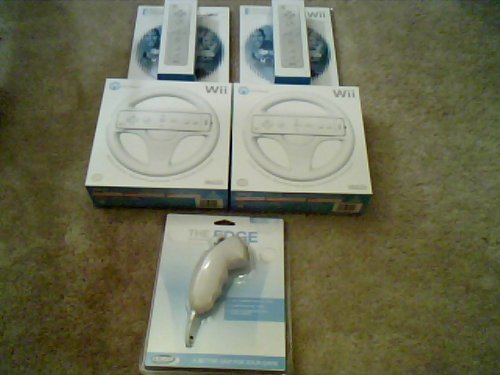 Nintendo Wii 5 Piece: 2 Mario Kart Wheels, 2 Wiimotes, and 1 Nunchuk (No Video games included)