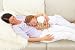 Wallmonkeys Peel and Stick Wall Decals - Smiling Mother and Daughter Lying on Couch at Home - 24"W x 16"H Removable Graphic