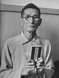 Japanese War Criminal Shumei Okawa Holding Buddhist Bible at His Arraignment Photographic Poster Print by Alfred Eisenstaedt, 18x24