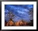 Mursi Huts Protect Tenants from the Oncoming Storm, Ethiopia World Culture Framed Art Poster Print by Janis Miglavs, 31x25