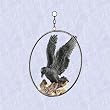 Perched raven in a ring statue home garden sculpture