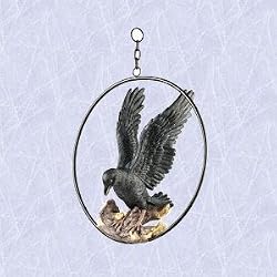 Perched raven in a ring statue home garden sculpture