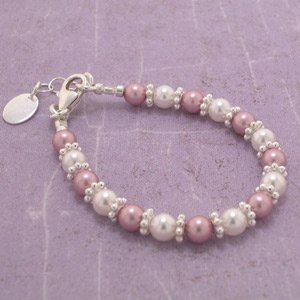 Click here to buy Sterling Silver Daisies and Swarovski Pearl Baby Bracelet by Hosiery & More.