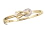 10k Yellow Gold Plated Sterling Silver Diamond Figure-8 Bangle Bracelet (1/10 cttw)
