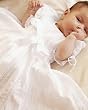 Infant short sleeve white batiste Charlotte dress. Hand embroidered. Heirloom quality baby clothes.