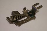 Greist Rotary Multi Slot Binder -- fits Rotary Machines that Accept a 3/16" foot opening -- White, Domestic, Kenmore Sewing Machines, etc. -- Designed with slots to accommodate 5 different widths of commercial binding in addition to familiar 15/16" bias cut -- as shown
