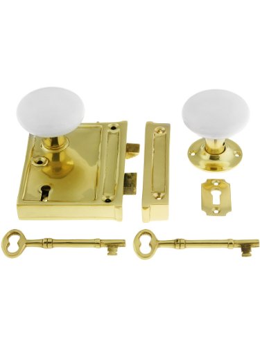 Image of Polished Brass Vertical Rim Lock Set With White Porcelain Door Knobs.