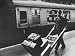 Railroad Porter Pushing Hand Truck Loaded with Baggage Past Passenger Car at Railroad Platform Photographic Poster Print by Terence Spencer, 16x12