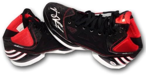Autographed Derek Rose Adidas pair of shoes with one shoe signed.