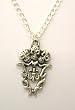 Metal Skulls Trio Fleur De Lis Pendant on Metal Chain