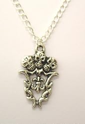 Metal Skulls Trio Fleur De Lis Pendant on Metal Chain