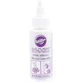 UPC 070896069276 product image for Wilton Dab-N-Hold Edible Adhesive, 2fl.oz. | upcitemdb.com