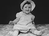 IMAGE OF Baby Girl (12-18 Months) in Bonnet Sitting on Bedspread, Close-Up Photographic Poster Print by George Marks, 30x40