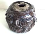 Four Side Head Clay Sculpture