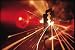 Red Laser Light Focused Through Lens Blasts Pin Point Hole Through Razor in Thousandt...