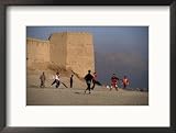 Children Playing Soccer Near Disused Fort, Kabul, Afghanistan Framed Photographic Poster Print by Stephane Victor, 21x17
