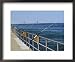 Fishing Poles Along St. Clair River, Port Huron, MI Framed Art Poster Print by Dennis Macdonald, 22x18