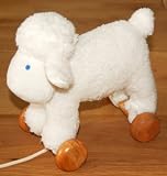 Review FurniToys  / A Pull Along Sheep with removable wooden wheels so it doubles up as a cuddly soft toys as well. How clever is that?
