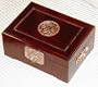 Rosewood jewelry box with brass longevity symbol